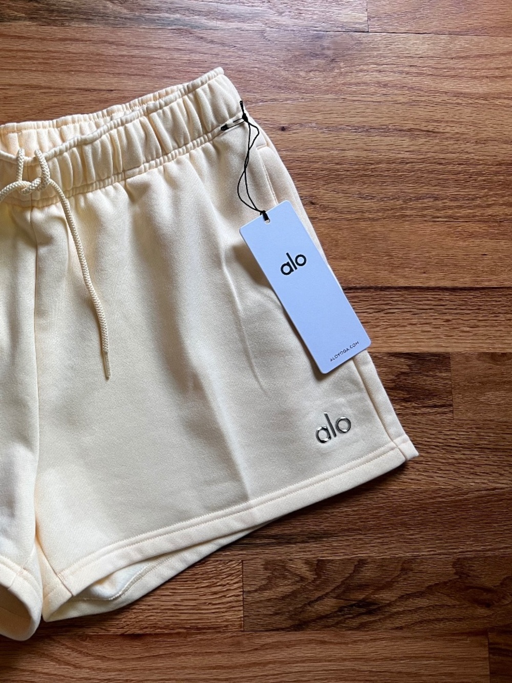 ALO Yoga Candlelight Yellow High-Rise Athletic Shorts with Drawstring - Picture 3 of 15